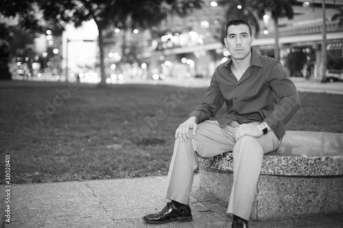 Photo: Man sitting on a park bench Man sitting on a park bench