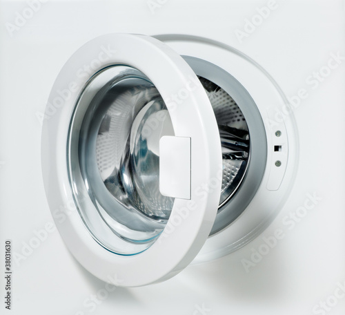 Photo: washing machine door with empty drum washing machine door with empty drum