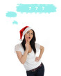 Foto: pretty casual woman in red christmas hat making a wish. isolated pretty casual woman in red christmas hat making a wish. isolated