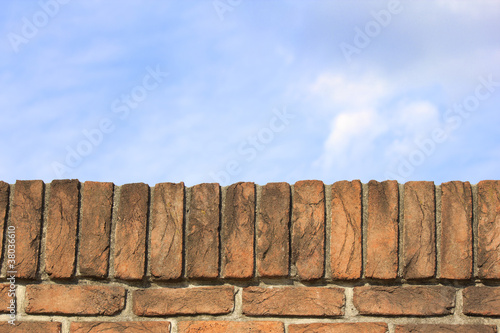 Photo: Blue Sky Behind a Brick Wall Blue Sky Behind a Brick Wall