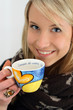 blonde girl whit a cup of tea