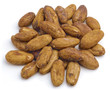 Raw cacao beans isolated on white background.