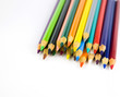 Multi colored pencils in a corner on a white background Multi colored pencils in a corner on a white background
