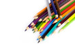 Multi colored pencils in a corner on white background Multi colored pencils in a corner on white background