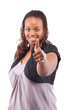 Young black woman giving a thumbs up sign - isolated over white