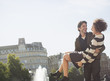 Man carrying woman in city