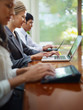 business man and women typing on pc during meeting