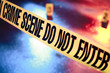 fresh crime scene with yellow tape at night