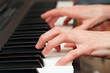 Hands of the musician on a synthesizer