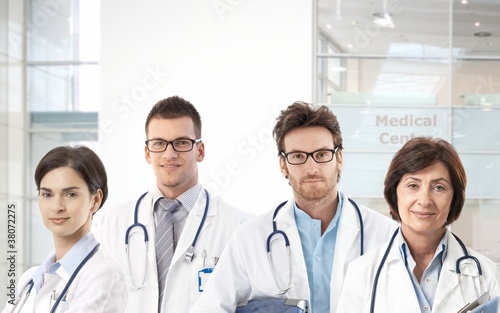 Photo: Team of doctors in hospital lobby Team of doctors in hospital lobby