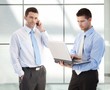 Young businessmen in office lobby