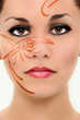 Foto: Beautiful Woman Face with Henna Tattoo Closeup Beautiful Woman Face with Henna Tattoo Closeup