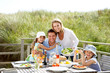 Family on vacation eating outdoors