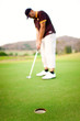 Golfer doing putt