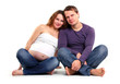 Photo: Young couple expecting baby over white Young couple expecting baby over white
