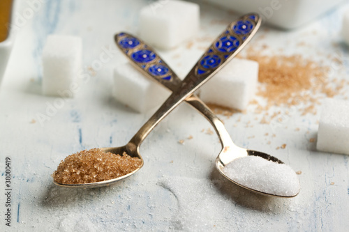 Photo: Tow spoons with sugar Tow spoons with sugar