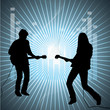 Silhouettes of two guitarists against background