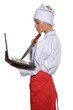 happy woman-cook with laptop and knife