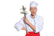surprised woman- chef with knife and money