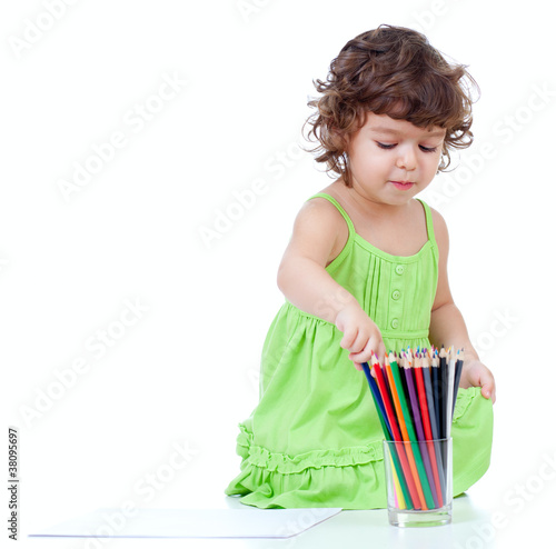 Photo: Little girl drawing with pencils Little girl drawing with pencils