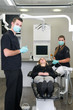 Dentist with nurse and patient