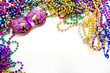 Mask and mardi gras beads