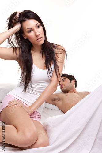 Photo: Distraught Young Woman On Bed Distraught Young Woman On Bed