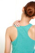 young woman doing self shoulder massage