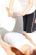 young Japanese woman getting a chiropractic