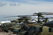 A number of modern military helicopters in the parking