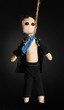 Hanged doll voodoo boy-groom on grey background