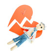 Voodoo doll boy on the broken heart isolated on white