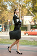 businesswoman  with coffee walking