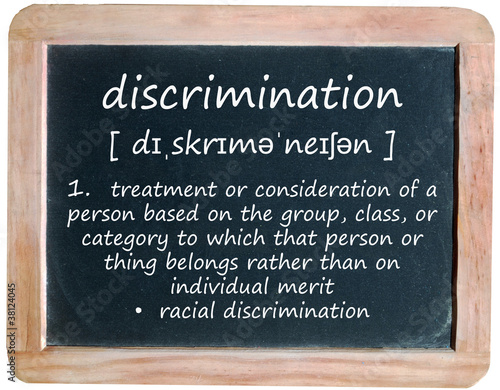 Photo: DISCRIMINATION definition on blackboard (equal rights law human) DISCRIMINATION definition on blackboard (equal rights law human)
