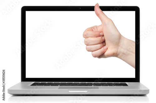Photo: Laptop with blank screen and OK hand isolated on white Laptop with blank screen and OK hand isolated on white