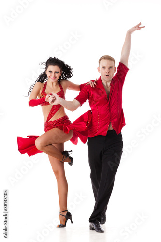 Photo: Dancing young couple. Dancing young couple.