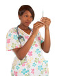 African American Nurse Checking Dosage in a Syringe