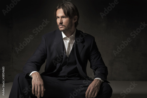 Photo: Fashionable man sitting Fashionable man sitting