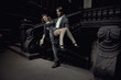 Elegant man carrying a beautiful brunette