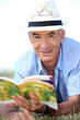 old man reading a book