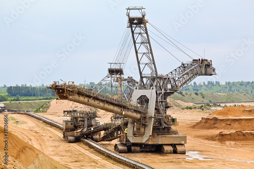 Photo: Bucket-wheel excavator in an open pit. Bucket-wheel excavator in an open pit.