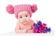 portrait of a beautiful baby in the hat with flowers