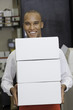 Portrait of industrial worker holding containers