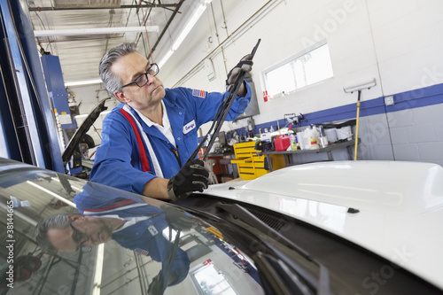 Photo: Senior mechanic working on windshield wipers Senior mechanic working on windshield wipers