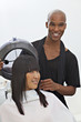 Asian woman getting herself groomed at hair salon
