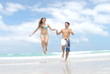 Video: Young happy couple in love at the beach - slow motion Young happy couple in love at the beach - slow motion