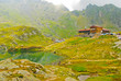 House by the lake in the mountains, Carpathians, Romania, Europe House by the lake in the mountains, Carpathians, Romania, Europe