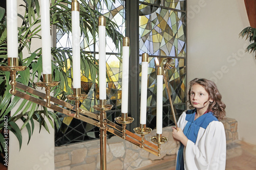Photo: Young girl in the church Young girl in the church