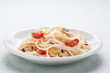 Tagliatelle sautéed with tomatoes and mushrooms