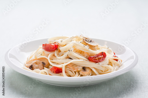 Photo: Tagliatelle sautéed with tomatoes and mushrooms Tagliatelle sautéed with tomatoes and mushrooms